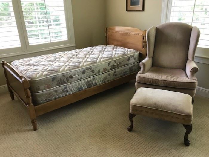 One of Two twin beds and a comfy wingback with ottoman