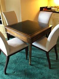Square game table and four more parsons chairs.  Asking $400 for the four chairs and $140 for the game table