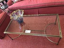 glass and brushed brass coffee table - measures 48"l x 24"w x 17.25"high.   