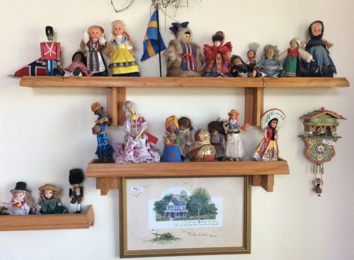 Collection of dolls, stuffed animals, and beanie babies