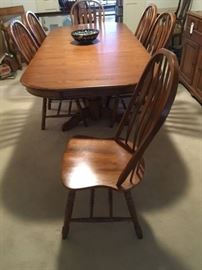 An Oak Dining Table and Six Chairs