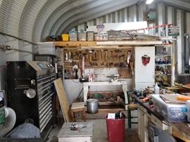 Metal Building filled to the brim, overflowing to another builoing