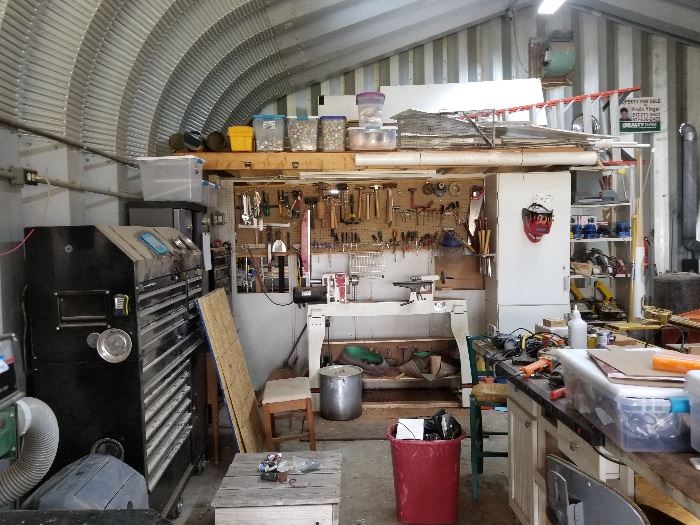 Metal Building filled to the brim, overflowing to another builoing