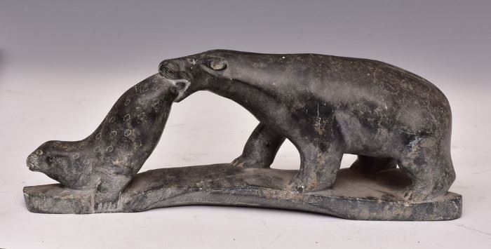 Inuit Sculpture Bear And Seal
14" long 5" high
signed bottom Moses Smith             Bid on-line today through March 21st at www.fairfieldauction.com
