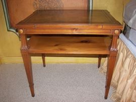 one of a pair of leather  topped side tables