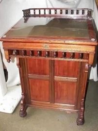 antique slanted top Davenport desk with side drawers and storage under top