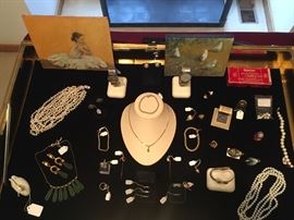 Small Paintings by Jeff Boutin amongst Skagen Watches Pearl Necklaces, many Gold pieces of jewelry including Diamond Bands and Platinum and 24k Gold Ring.