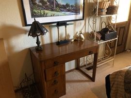 THIS IS A WATER TOWN SLIDE TABLE/DESK.  IT PULLS OUT AND HAS THREE LEAVES THAT GO IN IT. 