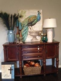 Entry piece or buffet with peacock accessories