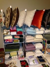 Assorted bed linens and pillows