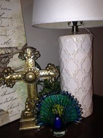 Cross, lamp, and peacock