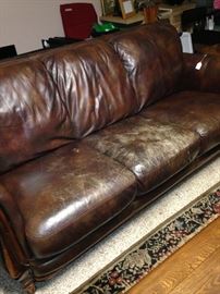 Leather sofa (as is) has matching love seat.