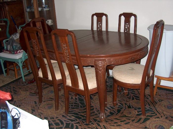 teak dining table and chairs; have several rugs also