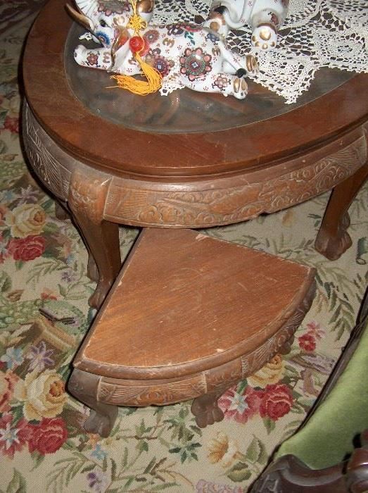 coffee table with carved inset & glass top with 6 stools that fit underneath; over 40 years old!teak wood