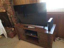 Flat screen TV; nice TV stand