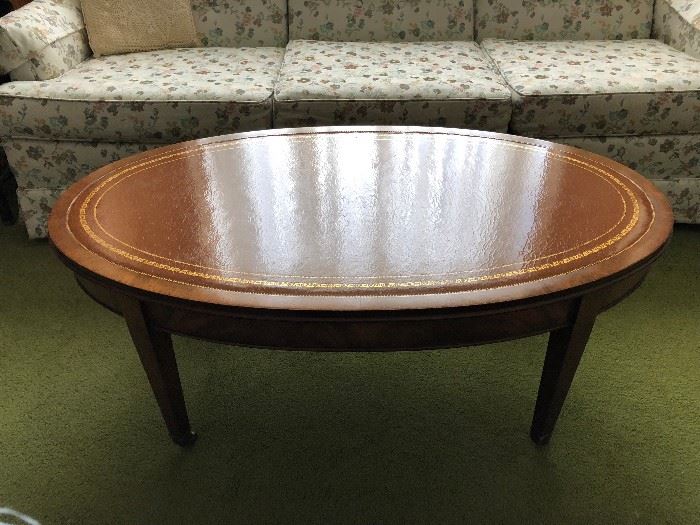 Mahogany coffee table with leather inlay