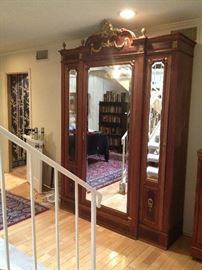 Large mirrored armoire, part of a large bedroom suite. Each piece sold seperately