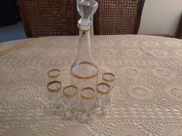  Alcohol decanter, 6 shot glasses gold rimmed  http://www.ctonlineauctions.com/detail.asp?id=696764