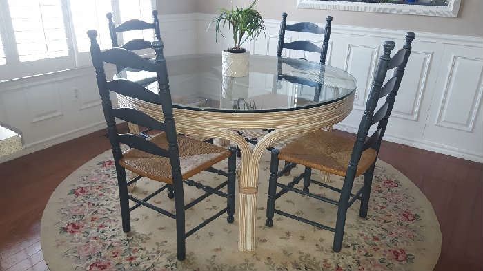 $150    Glass, round rattan base table    $50 each  Ladder back, green chairs