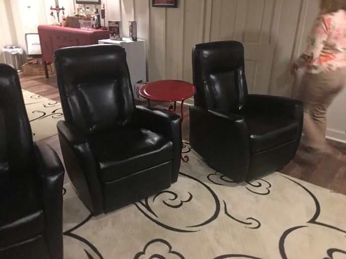 We have 6 of these rocking recliners in black leather.  They are in like new condition and ready for your theater space. 