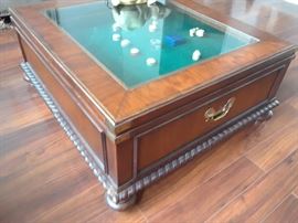 Large, square coffee table with display space.