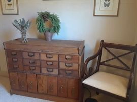Great antique filing cabinet. One of two chairs.