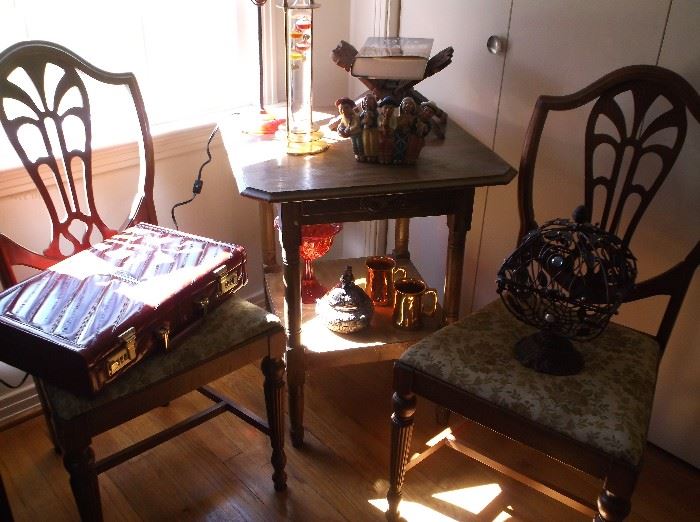 Center table and shield back chairs