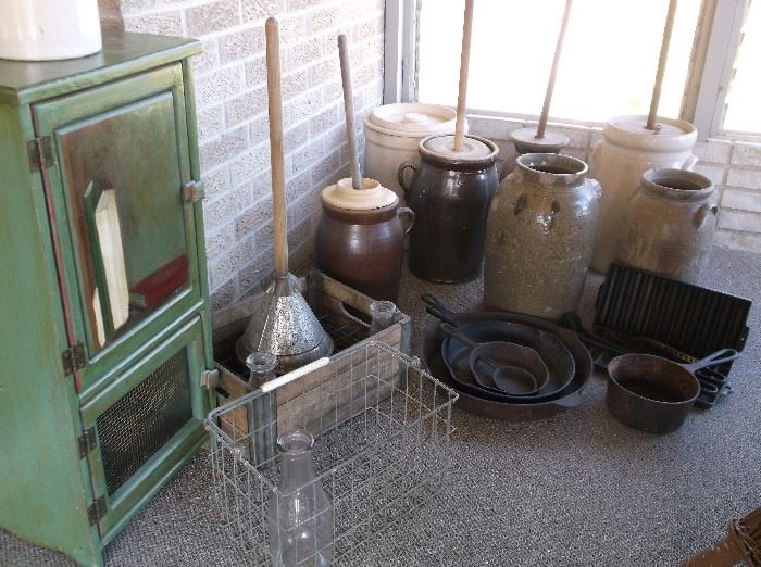 Churn collection, milk crates, cast iron , and green painted cabinet