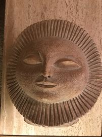 Large sun god sculpture