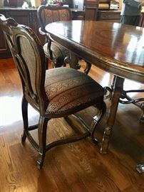 Oval dining table with 6 chairs by Marge Carson
