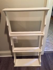 White shelf. Measures about: 18" wide,  5" deep, 35"  high