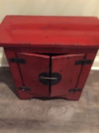 Red cabinet. Measures about: 21" long, 19.5" high, 11" wide