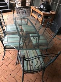 Wrought iron table - glass top - 6 chairs - extra fabric for chairs