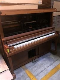 Player piano with rolls