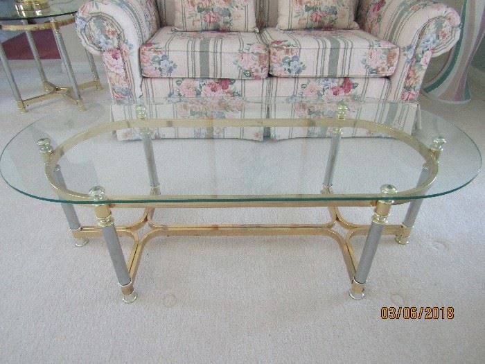 GORGEOUS OVAL COCKTAIL CONTEMPORARY TABLE.. BRASS, CHROME AND GLASS