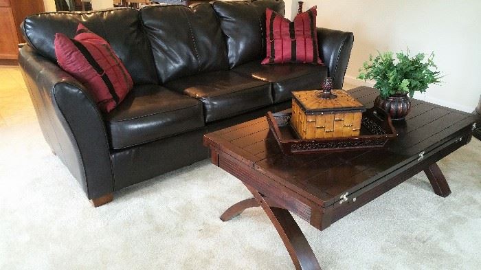 Dark brown leather triple cushion sofa and coffee table