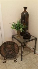 Small metal table, glass top, large plate on stand, decorative items