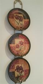 trio of dishes on wall in kitchen