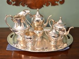 Sterling silver pitcher and tea service on silverplate tray