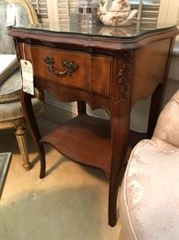 One of a pair of French Provincial style night stands
