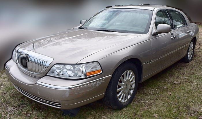 At 8PM: 2003 Lincoln Town Car Luxury Sedan Estate Auto | Signature Edition; Silver-Beige Metallic Exterior with Beige Leather Interior; Power Seats, Locks, Windows, Mirrors; 2-Position Memory Driver's Seat; Heated Front Seats; Dual Climate Controls; Power Moonroof; AM/FM Stereo with CD and Cassette, and more. VIN: 1LNHM82WX3Y642850