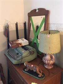 wooden dresser, electric typewriter, vintage lamp