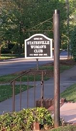 Watch for this sign.  Enter drive on the right of the house and follow to back for parking.