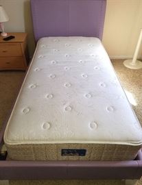 Twin platform bed, lavender faux leather, one damaged slat, complete with mattress (Sealy).