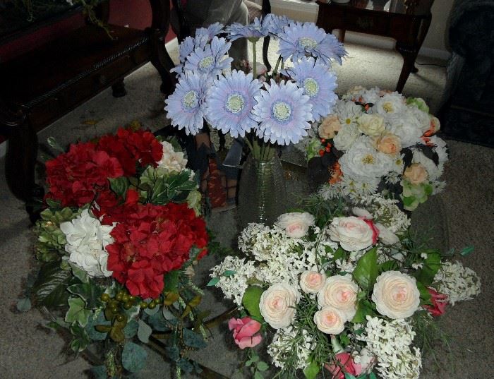 Many extra nice silk flower arrangements in attractive containers.