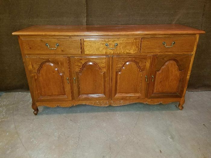 This buffet matches the dining table and china cabinet in this estate sale.