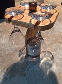 Adorable wine bar set: the wine bottle serves as the "stand" and holds four wine glasses.