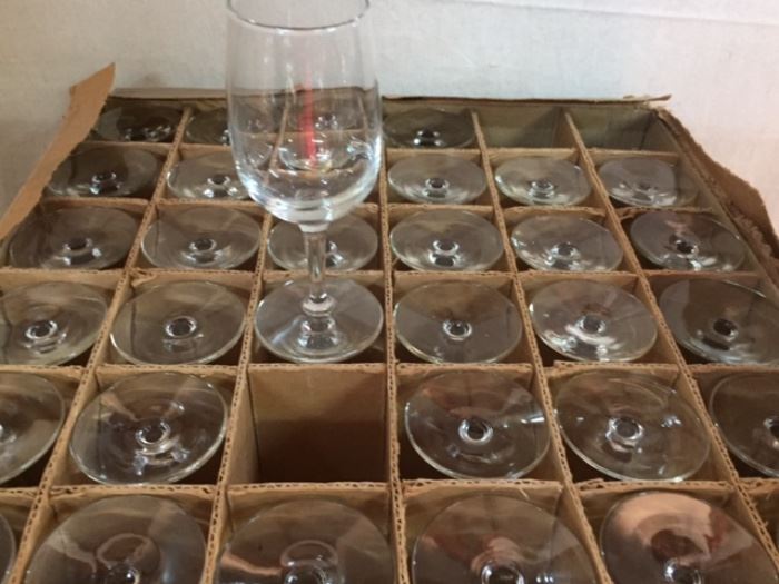 Nearly 40 glasses in this crate of new wine (stem) glasses. One is shown.