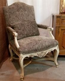 French style, wood framed chair with such lovely details and upholstery that it would make an ugly room, pretty.
