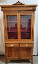 Vintage hutch with glass front doors.